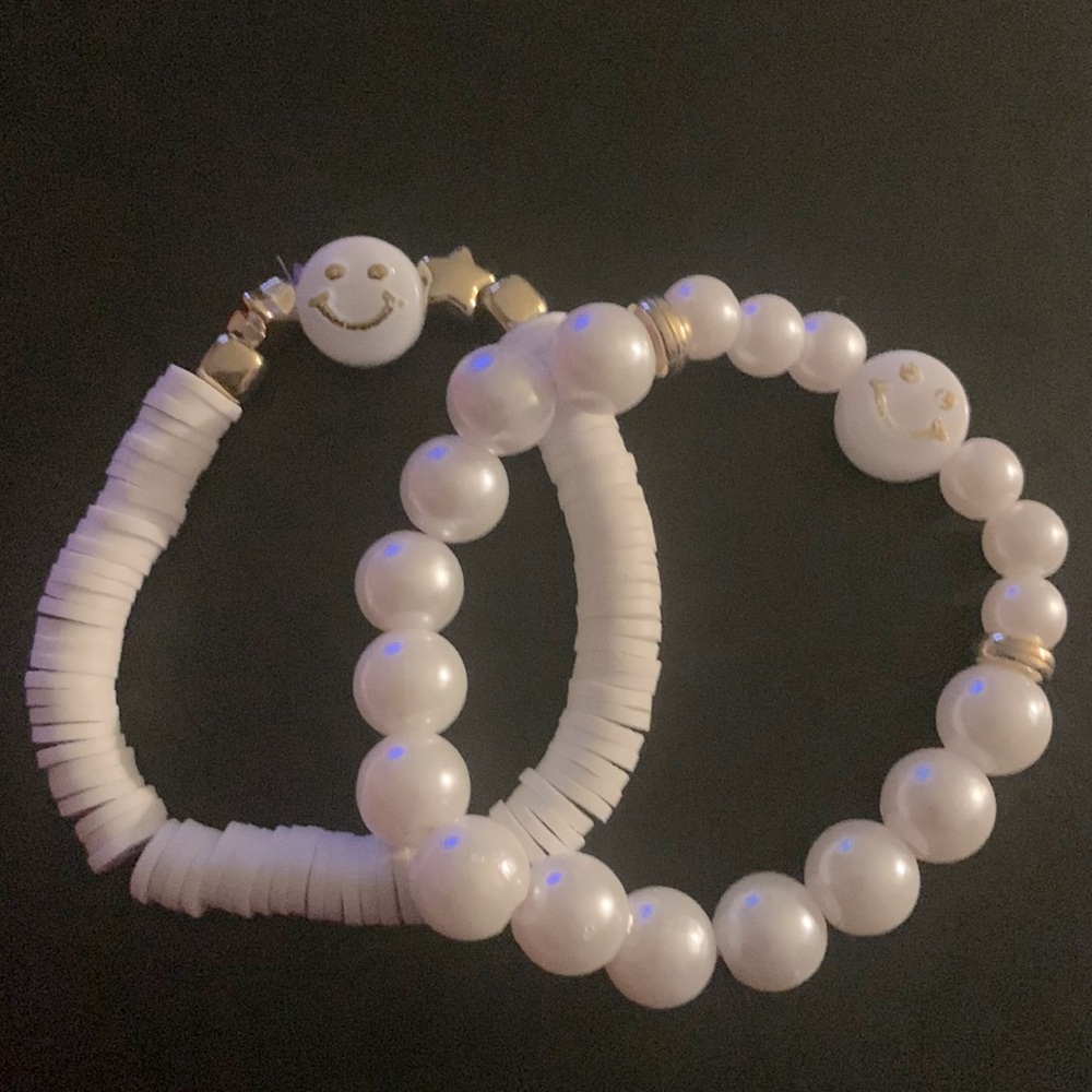 White and gold smiley face bracelets